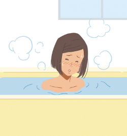 お風呂につかり体をあたためる患者さん